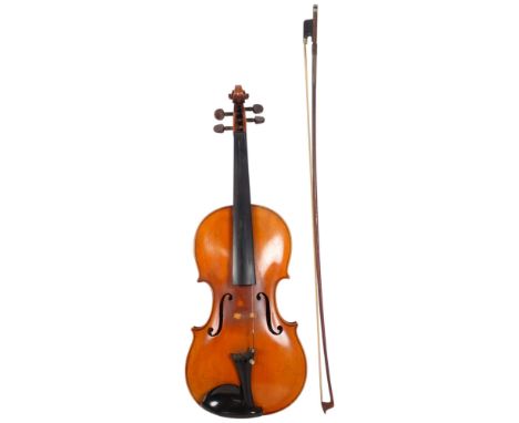 A full-size violin, label for Nicholas Amatus Cremona, back length 14", with bow, in fitted hardshell case