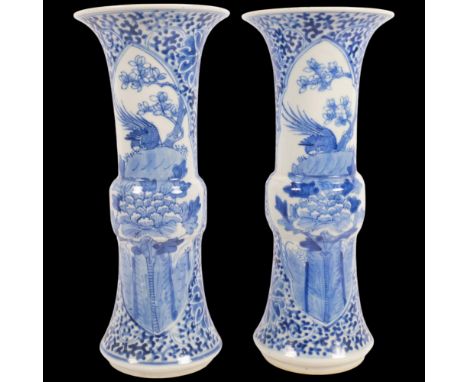 A pair of Chinese Kangxi blue and white Gu vases, hand painted bird decoration, 30cm1 top rim has a large chip otherwise only
