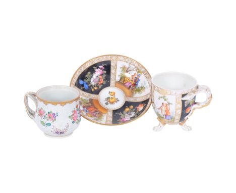 A 19th century Dresden cup on 3 feet, with painted designs of couples on matching saucer, and a German porcelain cup with flo