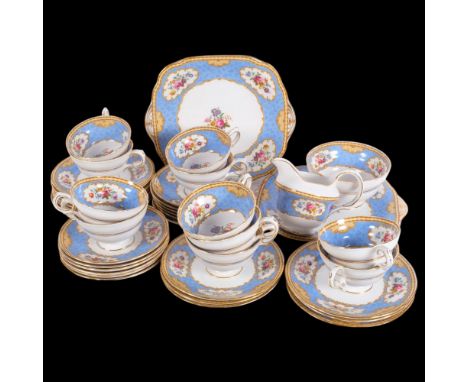 Extensive Staffordshire Vintage bone china tea service, with floral decorated panels on blue ground