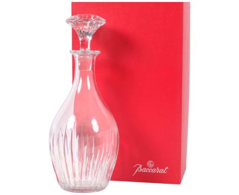 A Baccarat glass decanter and stopper, H27cmAs new condition. No obvious chips or crackers. Some light surface scratching onl
