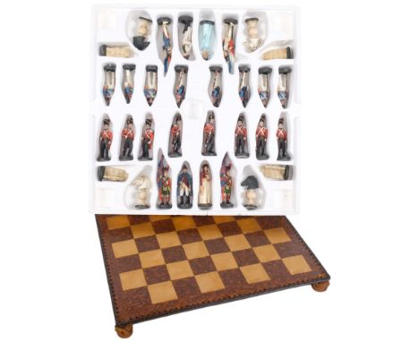 Plastic set of Regimental chessmen, 9.5cm, and chess board