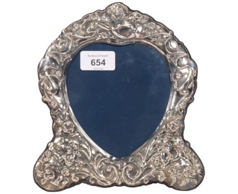 An Elizabeth II silver-fronted heart photo frame, maker DR&S, Sheffield 1990, relief embossed cherub and foliate decoration, 