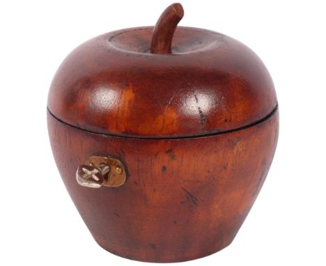 A tea caddy in the form of a turned wood apple, with lock and key, H12cm
