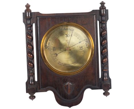 A 1920s oak-framed brass barometer, W37cm