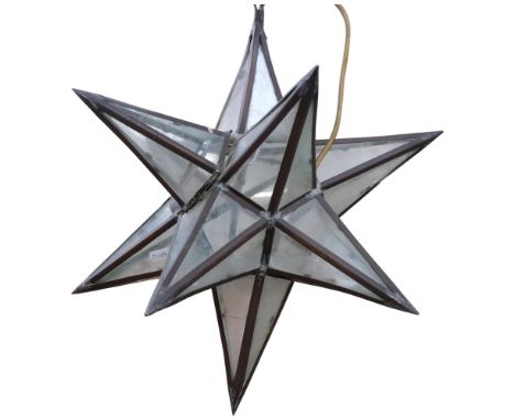 A ceiling light in the form of a star, with glass panels and metal mounts (some damage), 40cm across