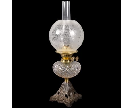 A Victorian cut-glass oil lamp on pierced cast-iron base, with chimney and etched glass shade, 52cm