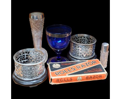 A silver-topped scent bottle and vase, 16cm, pierced plated bottle stands, razor, etc