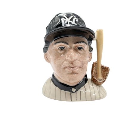 Bone china character jug of a New York Yankees player. White baseball, light brown baseball glove, and baseball bat formed th