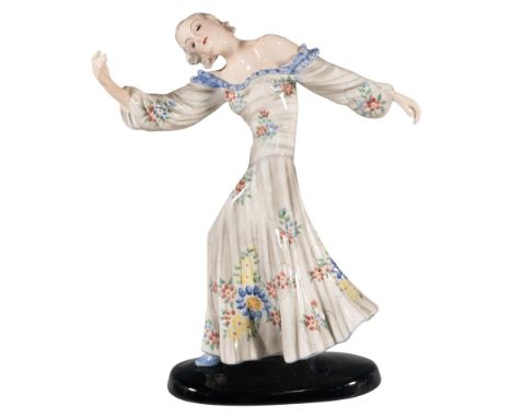 Art Deco figure of a dancer in a long pale gray floral dress with blue trims. Marked: Goldscheider backstamp and 8652 / 239 /