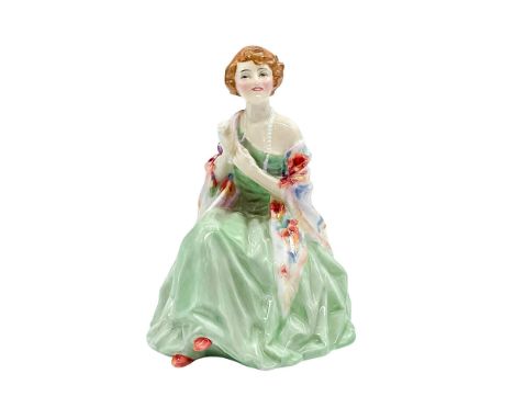Very rare early version Figure of a seated woman in a light green dress with a floral shawl. Royal Doulton backstamp. Artist: