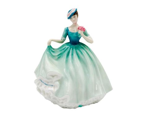 Bone china figure of a young lady in a mint green dress holing a bouquet of pink flowers.Royal Doulton backstamp. 'This item 