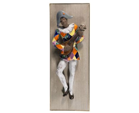 Placed on a rectangular wood and golden-color metal frame. A hand painted figure of a Venetian jester, playing a mandolin, in