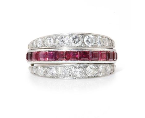 A ruby, sapphire and diamond swivel guard or flip eternity ring,with a half hoop of calibré cut rubies and a half hoop of cal