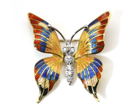 An Italian gold diamond and enamel butterfly brooch, with brilliant cut diamonds grain set to the white gold body, to yellow 