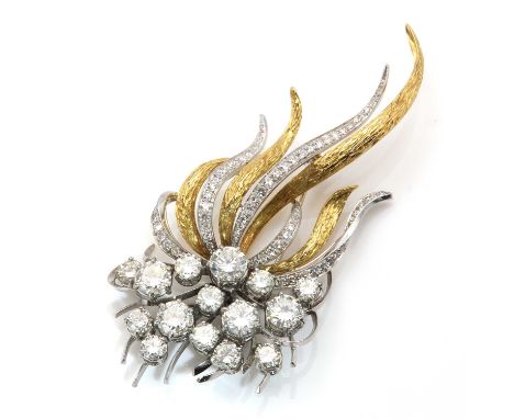 A two colour gold diamond spray brooch,a cluster of brilliant cut diamonds, with a total estimated weight of approximately 6.