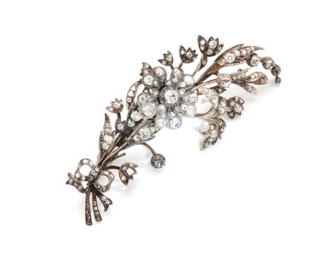 A late Victorian diamond set en-tremblant spray brooch,with a detachable brooch fitting, to enable it to also be worn in the 