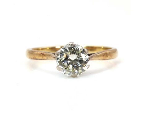 A single stone diamond ring,with a brilliant cut diamond, estimated as approximately 1.20ct, six claw set to a sea scroll col