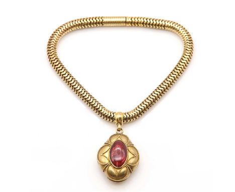 A Victorian garnet set bracelet,with a concealed box clasp and a detachable pendant. An elongated quatrefoil pendant of bombé