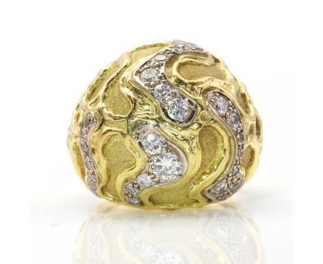 An 18ct gold diamond set bombé ring, by Leo De Vroomen, c.1970,with a domed head, with wavy rows of graduated brilliant cut d