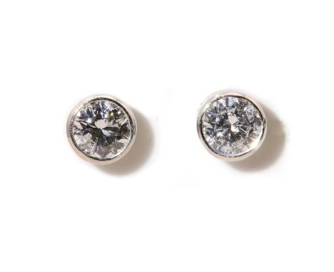 A pair of white gold single stone diamond stud earrings, round brilliant cut diamonds, with an estimated total weight of appr