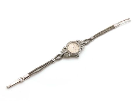 A Movado diamond set mechanical cocktail watch,on a later two row 9ct white gold mesh cordette bracelet. A circular 18mm case