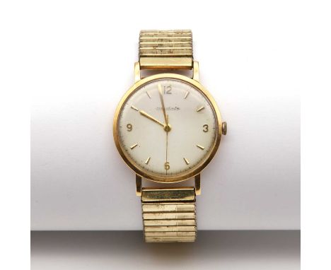 An 18ct gold Jaeger-LeCoultre mechanical bracelet watch,35.30mm diameter, with a silvered dial, baton hour markers and Arabic