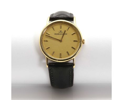 A gentlemen's 18ct gold Jaeger-LeCoultre mechanical strap watch,32mm diameter, with a gilt dial, raised baton hour markers an