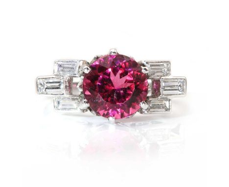 A platinum rubellite and diamond ring,with a circular mixed cut rubelite or pink tourmaline with a stated weight of 2.10ct, s