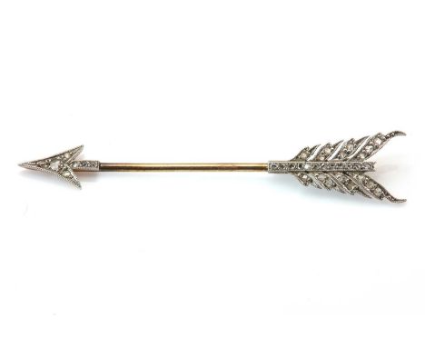 An early 20th century diamond set arrow pin or jabot,with graduated rose cut diamonds, milligrain set to the arrow tip and fl
