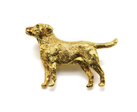 An 18ct gold dog brooch, by Harriet Glen, in the form of a labrador or retriever, with a textured coat and sapphire set eyes,