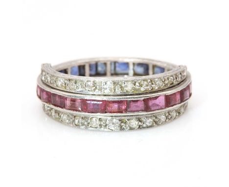 An Art Deco ruby, sapphire and diamond swivel or flip eternity ring,with a central hoop composed of a half row of calibré cut