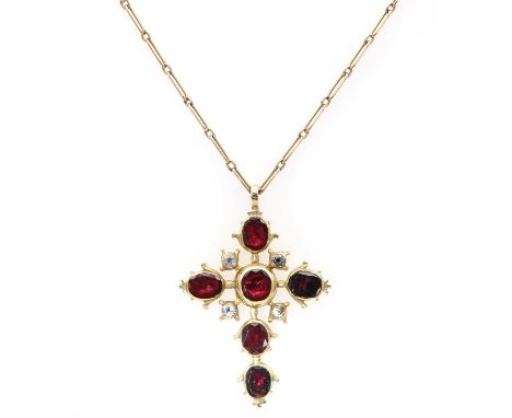 A late 18th century flat cut garnet and black dot quartz cross,suspended on an Edwardian fetter chain. The cross composed of 