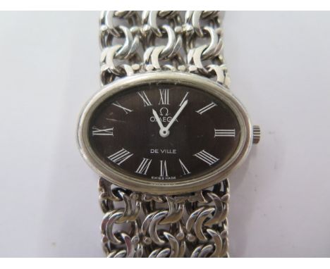 A 1975 silver Omega De Ville manual wind bracelet dress watch - 32mm case, 24mm bracelet, 18cm long - with paperwork and orig