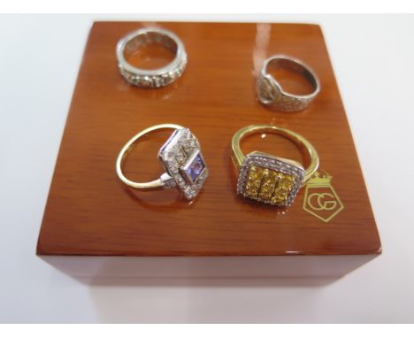 A Clogau silver Dathlu ring size K and three silver dress rings sizes I and O 