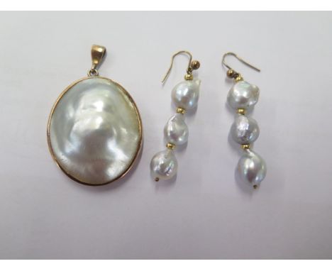 A pearl gilt mounted pendant - 34mm x 24mm and a pair of pearl drop earrings 