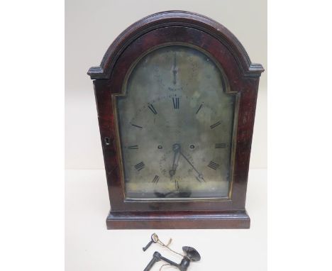 A 19th century 8 day bracket clock with a twin fusee movement striking on a bell - the silvered arched dial with strike silen