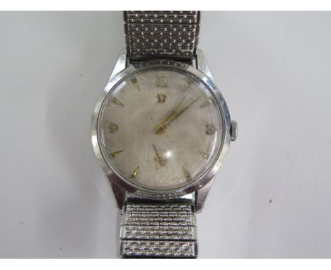 An Omega manual wind gents wristwatch with 34mm case on a sprung strap - running, dial worn, some usage marks 