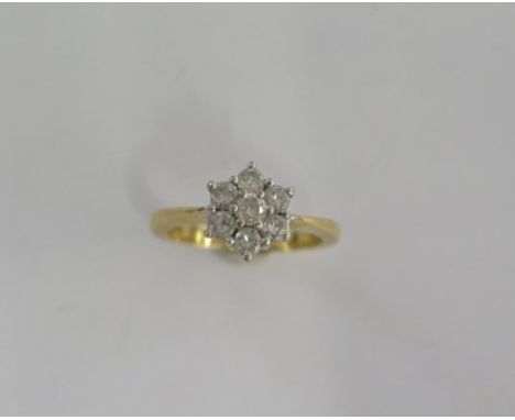 An 18ct yellow gold diamond cluster ring size J/K - approx weight 4 grams - good condition 