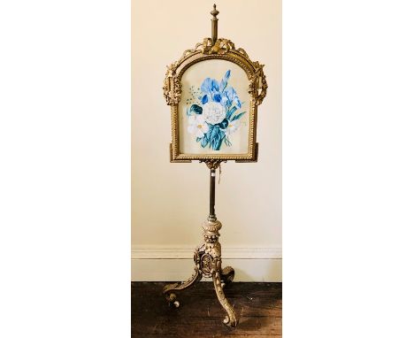 A 19th century French influence gilt wood and metal polescreen, globe finial top on a gilt metal pole, attached with an alcov