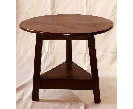 A mid 18th Century oak cricket table, circa 1750, circular table top on a triangular base, raised on triangular splayed suppo