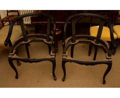 A pair of Chinese open frame armchairs, early 20th Century, lacquer with curved backs, scroll arms, serpentine seat rails, ca