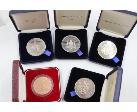 Four Lombard RAC Rally finishing medals 1988-1991, and one Medical Community Award. UK P&amp;P Group 1 (£16+VAT for the first