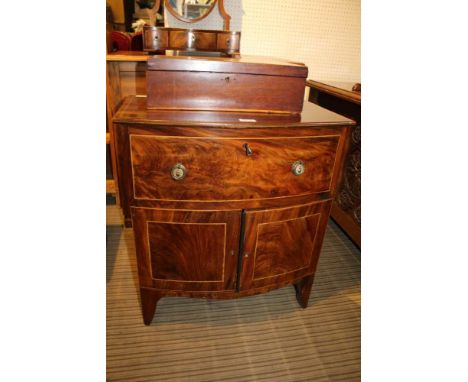 A 19TH CENTURY BOW FRONT UNIT, having single deep upper drawer over two plain panelled cupboard doors, supported on plain bra