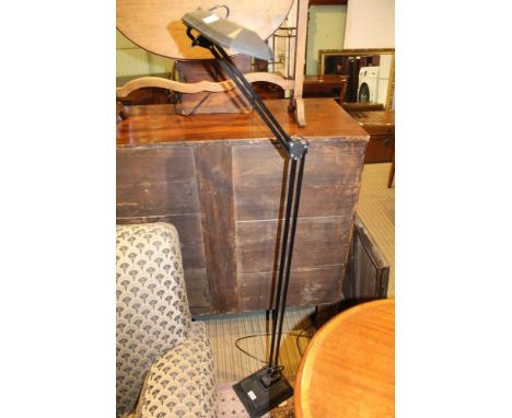 A MODERN BLACK FINISHED FLOOR STANDING ADJUSTABLE TASK LAMP 