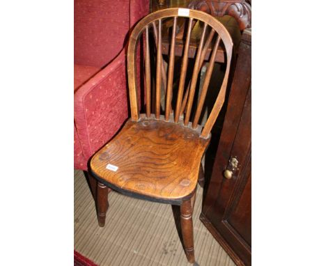 A PROBABLE 19TH CENTURY HOOP &amp; STICK BACK SOLID SEATED CHAIR with old metal fixings 