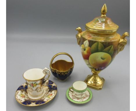 Coalport urn shaped vase and cover, hand painted with fruit by Anthony Baggott, gilt rams head handles finial and square base