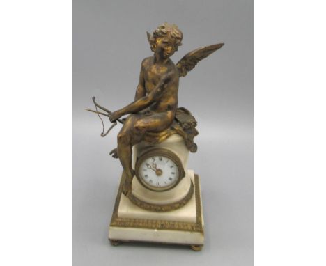 19th Century French gilt bronze and white marble figural timepiece, circular pillar mounted with a seated figure of cupid on 