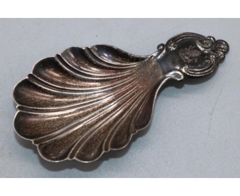 Victorian silver caddy spoon, shell bowl with scroll cartouche handle, engraved with crest, by Martin, Hall &amp; Co, Sheffie