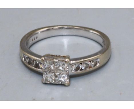 18ct white gold ring set with four square cut diamonds in square shaped claw setting, on half diamond set eternity band, stam